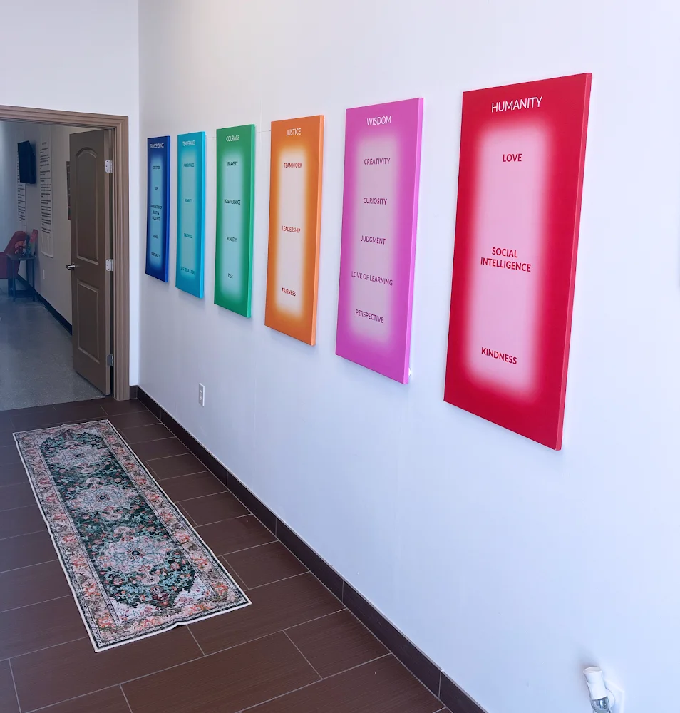 Hallway with colorful inspirational posters on the wall.