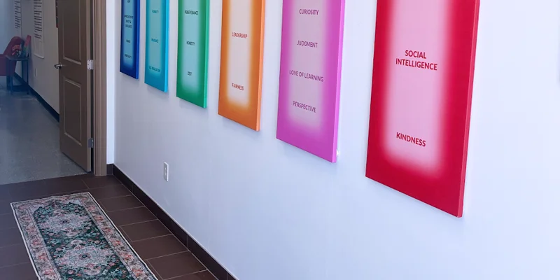 Hallway with colorful inspirational posters on the wall.