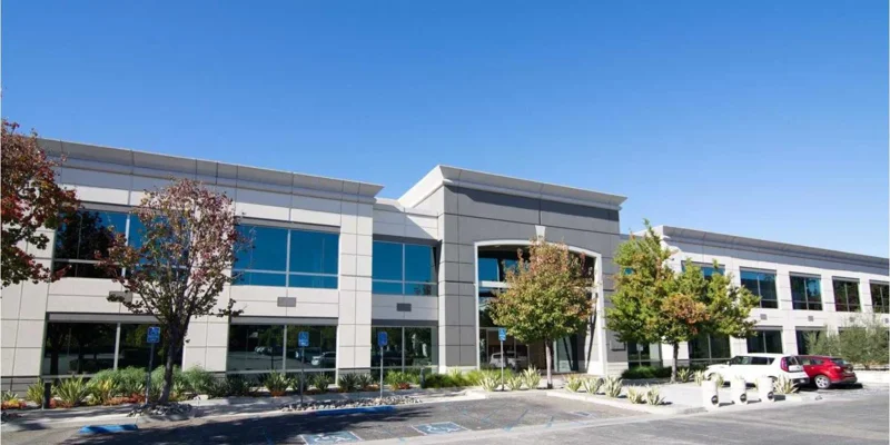 Facility front with entrance and accessible parking.