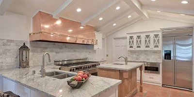 Kitchen with a central island and seating.