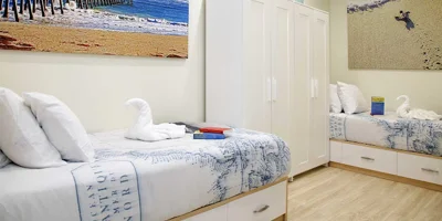 Shared bedroom with two beds.