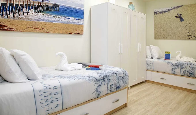 Shared bedroom with two beds.