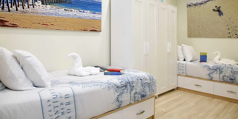 Shared bedroom with two beds.
