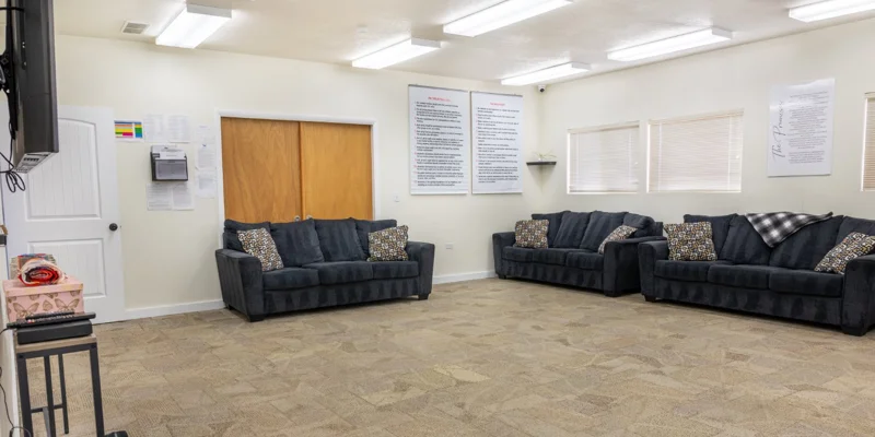 Group meeting room with couches and posters