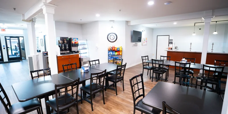 Dining area with snack bar, coffee station, and TV