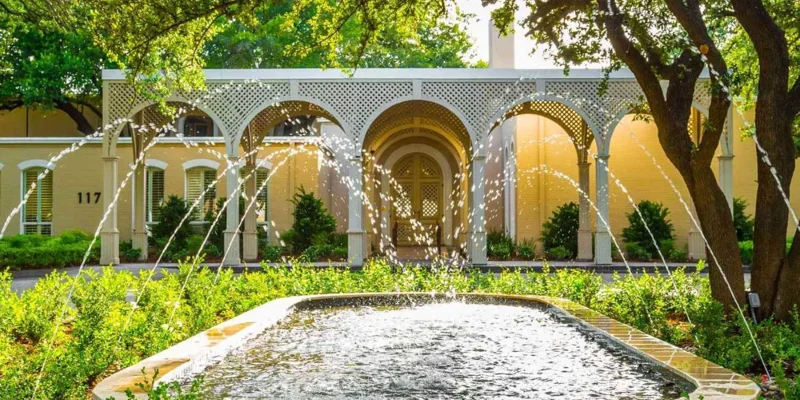 A courtyard fountain with arched entry at a rehab facility.