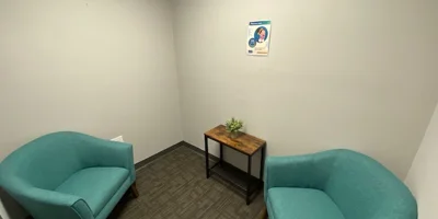 Lounge area with sofas, and a side table.