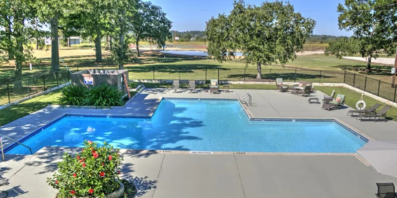 Outdoor pool area with seating.