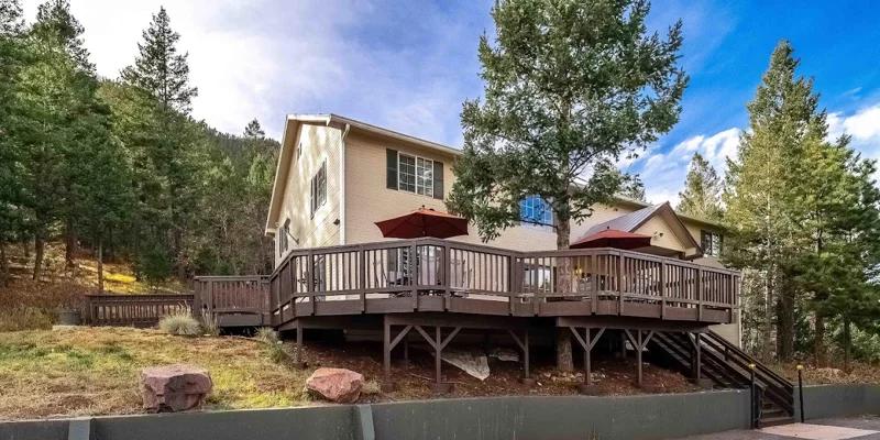 Facility front wooden deck and stairwell entrance.