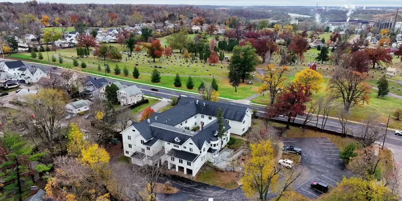 Aerial view of Radix Recovery surrounded by fall trees