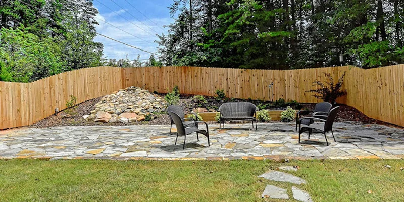 Outdoor common area with seating and stone paving.