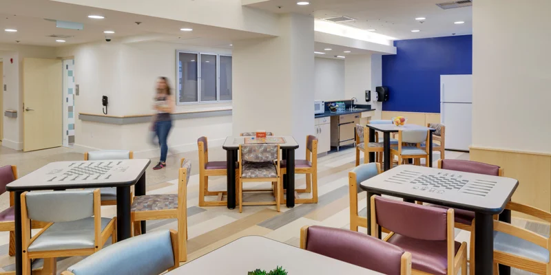 Cafeteria with tables for dining.