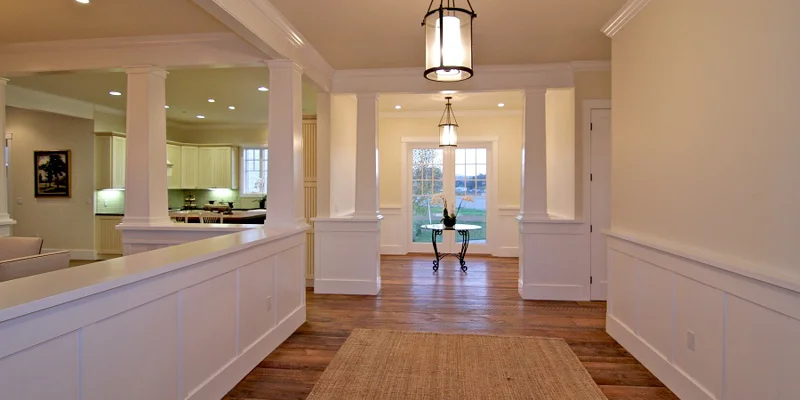 Hallway with kitchen in view.