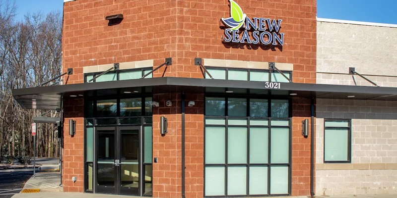 Facility exterior with a brick facade and entrance.
