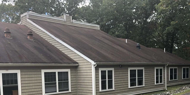 The exterior of a rehab facility with a sloped roof and windows.