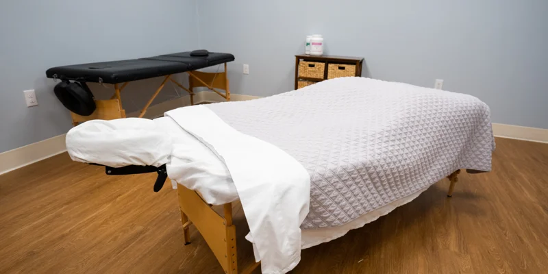 Peaceful massage room with two treatment tables