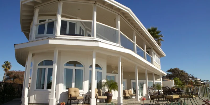 Large patio with outdoor seating and ocean views.