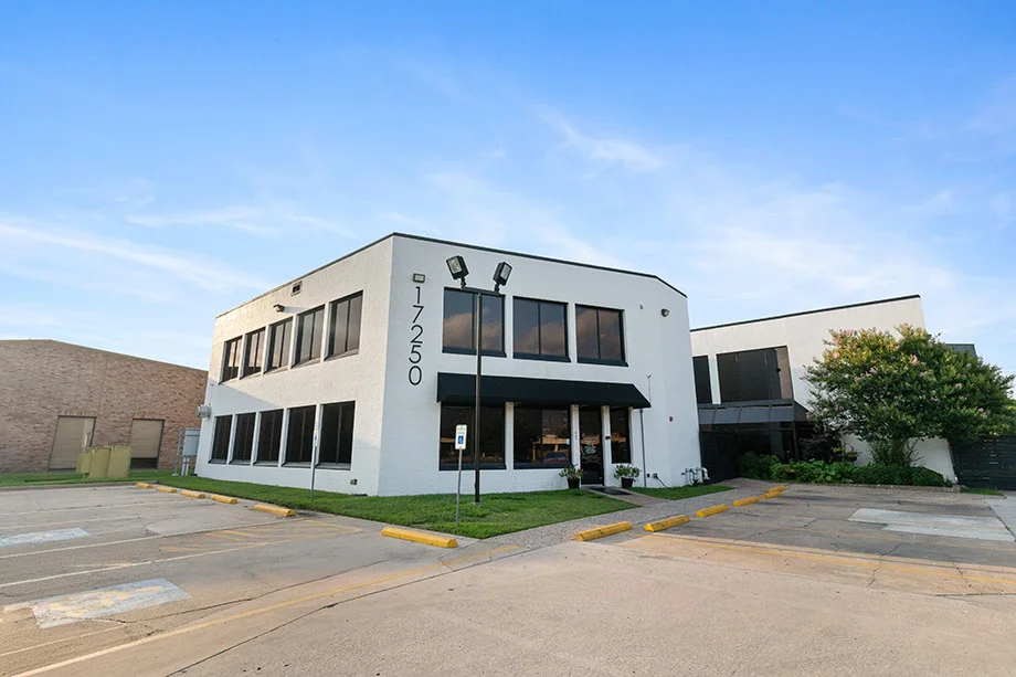 White two-story rehab center building with large front windows