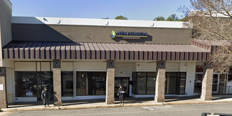 Facility exterior with signage and parking.