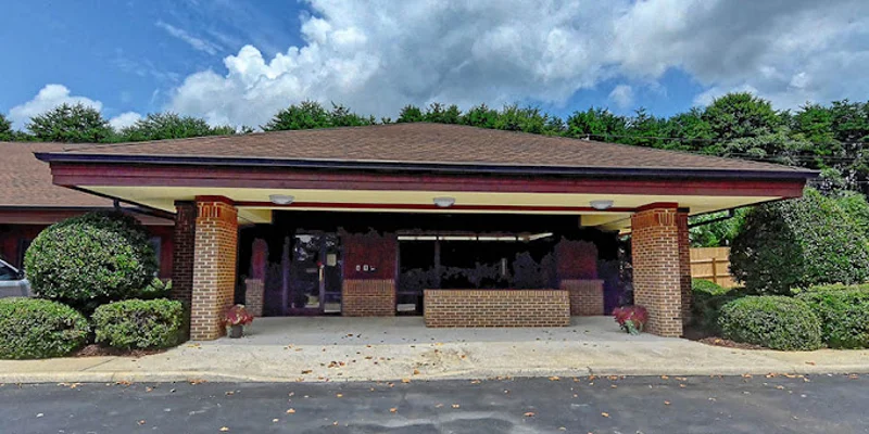 Covered entrance with brick columns at main entrance