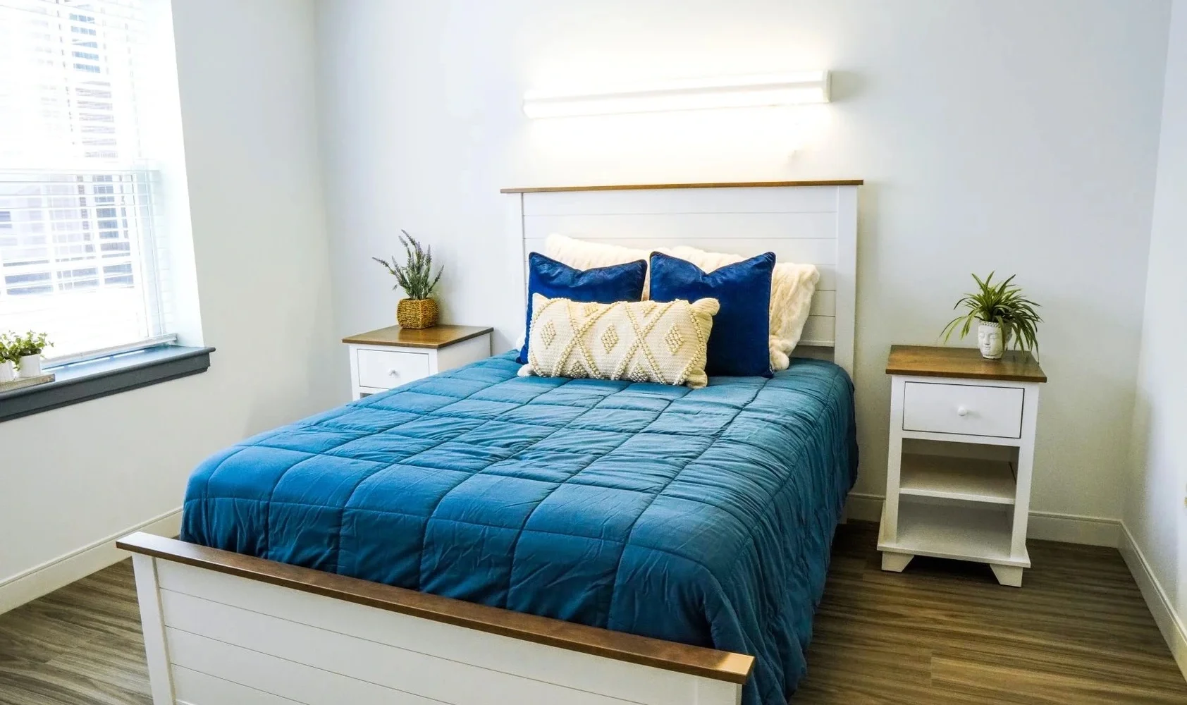 Private bedroom with a bed and side-tables.