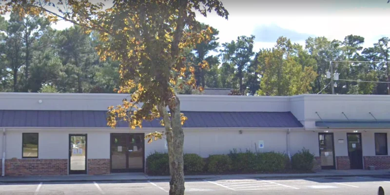 Facility exterior with entrance and accessible parking.