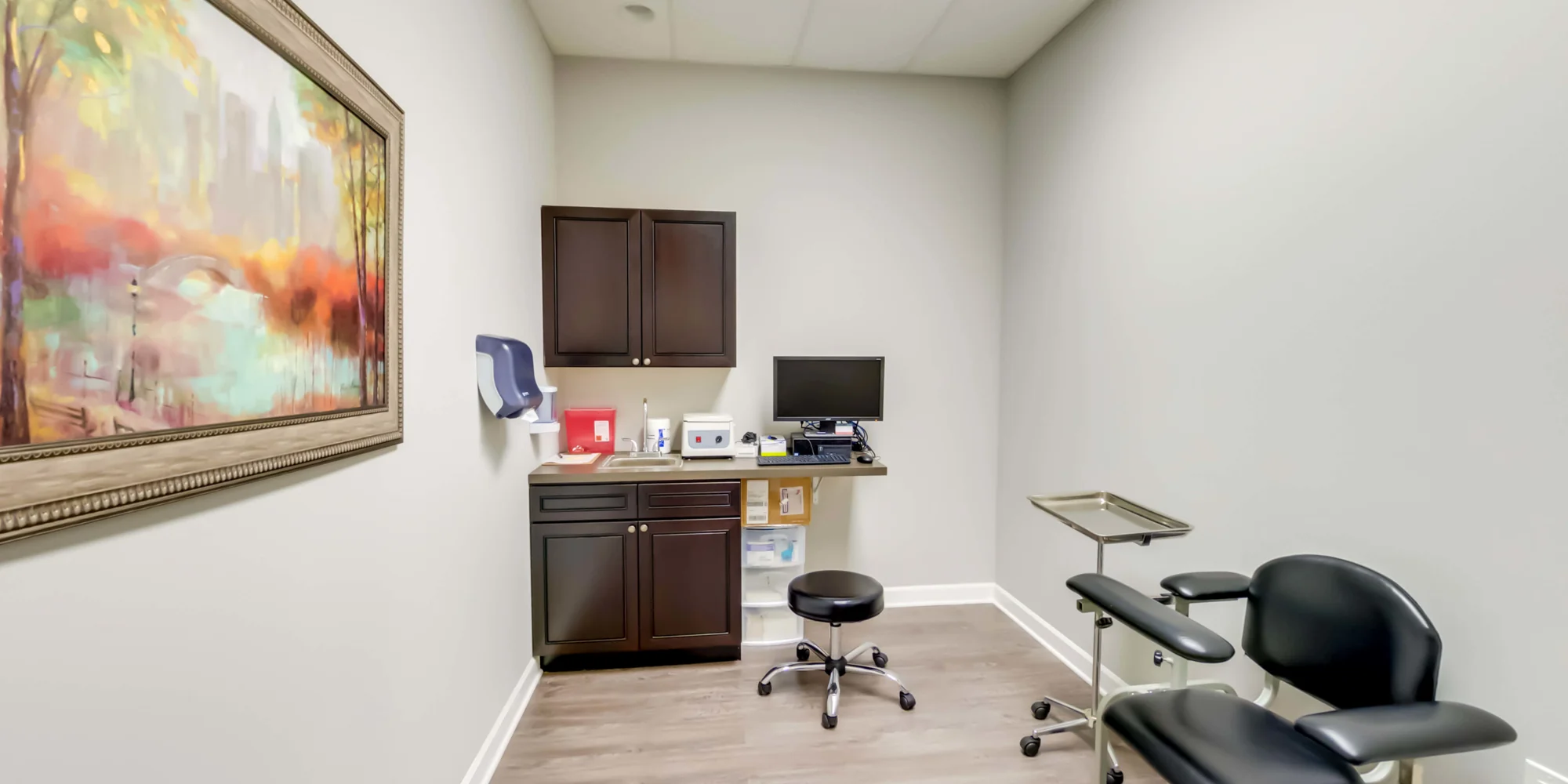 Bright therapy space with chairs and a window view.