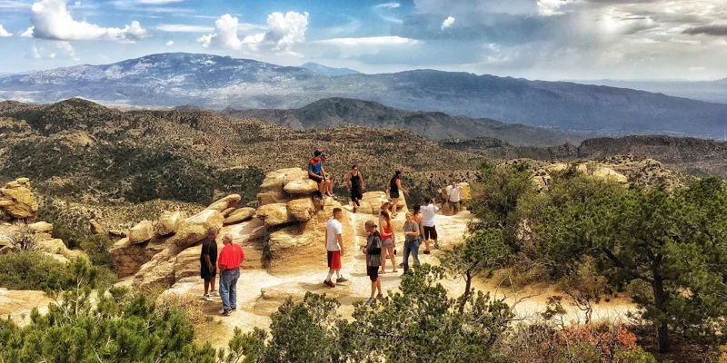 Group hiking in a scenic mountain landscape.