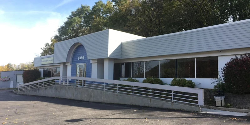 Facility front entrance with accessible parking.