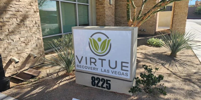 Facillity entrance with signage outside.