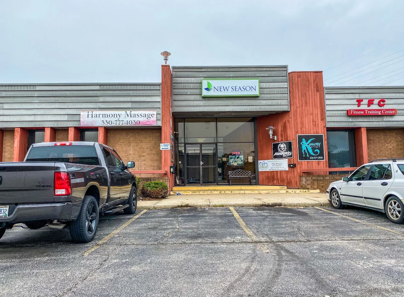 Facility exterior with parking in plaza.