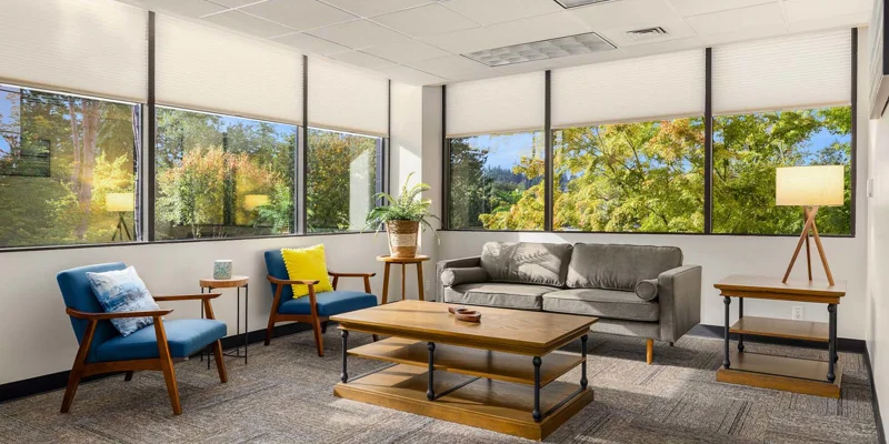 Lounge with seating and a table.