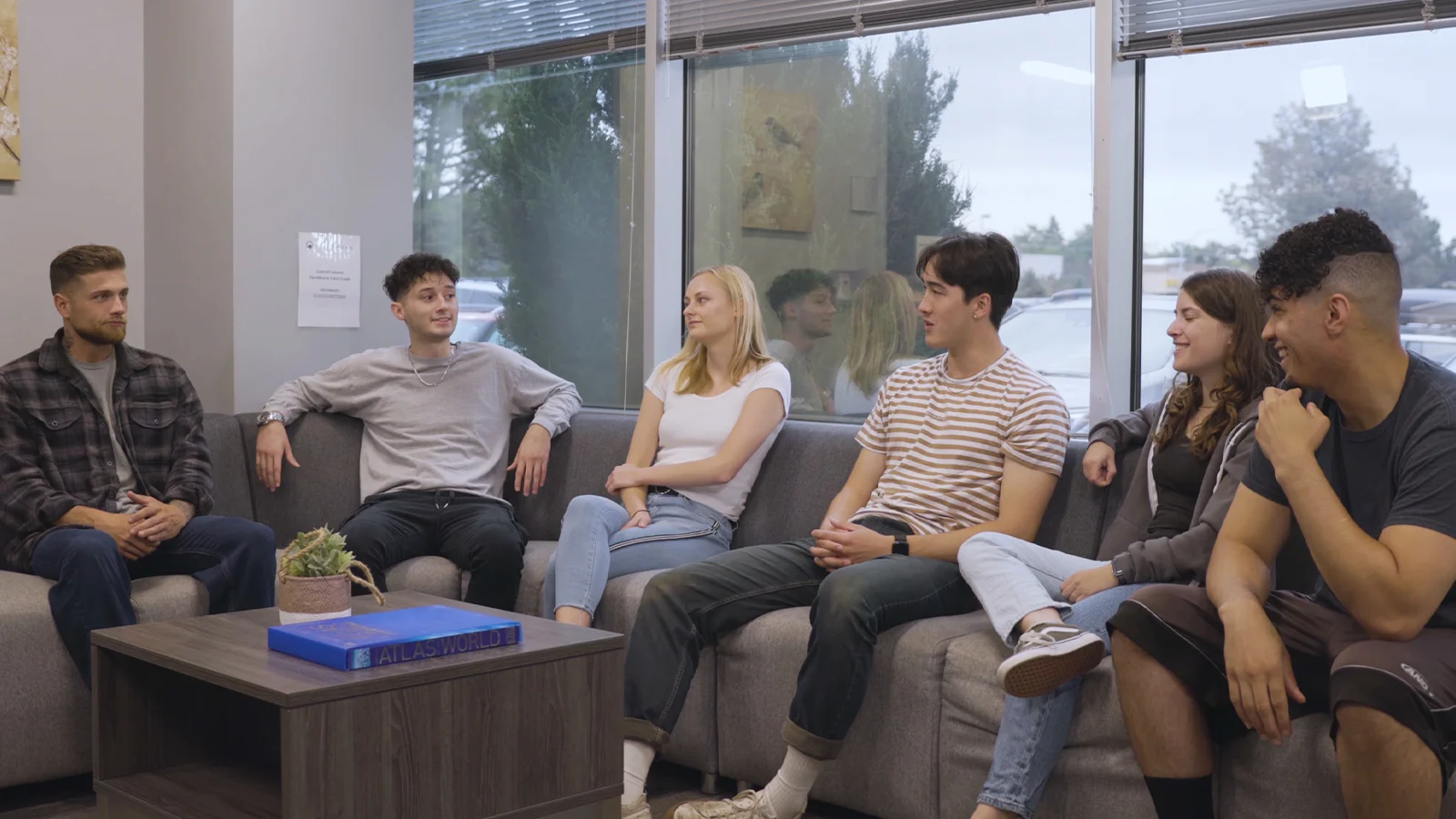Discussion in a group therapy space with chairs in a  circle.