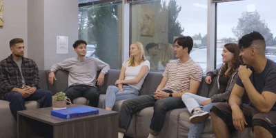 Discussion in a group therapy space with chairs in a  circle.