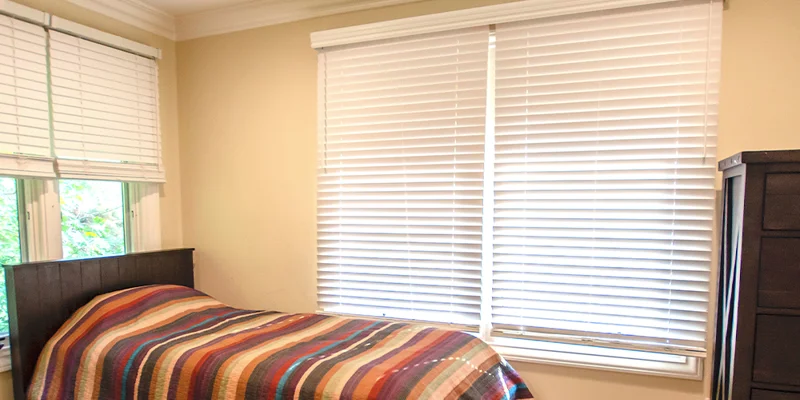 Private bedroom with bed and closet.