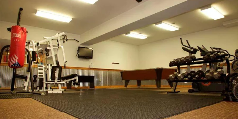 A well-equipped fitness center with weights and cardio machines