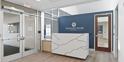  The front reception area with a blue accent wall.