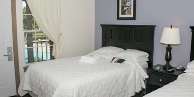 Shared bedroom with two beds.