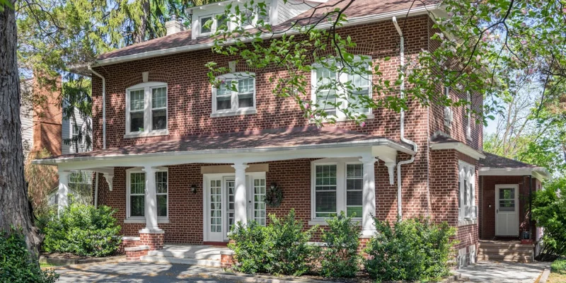 Brick building with front porch.