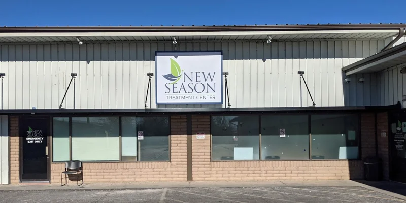 Front entrance of New Season Treatment Center with a large sign.