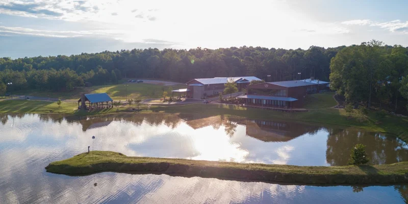 Aerial view of a rehab facility with a lake