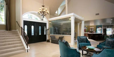 Living area with seating and stairs.