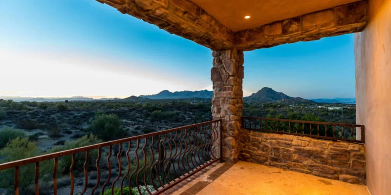 Balcony with scenic desert mountain views.