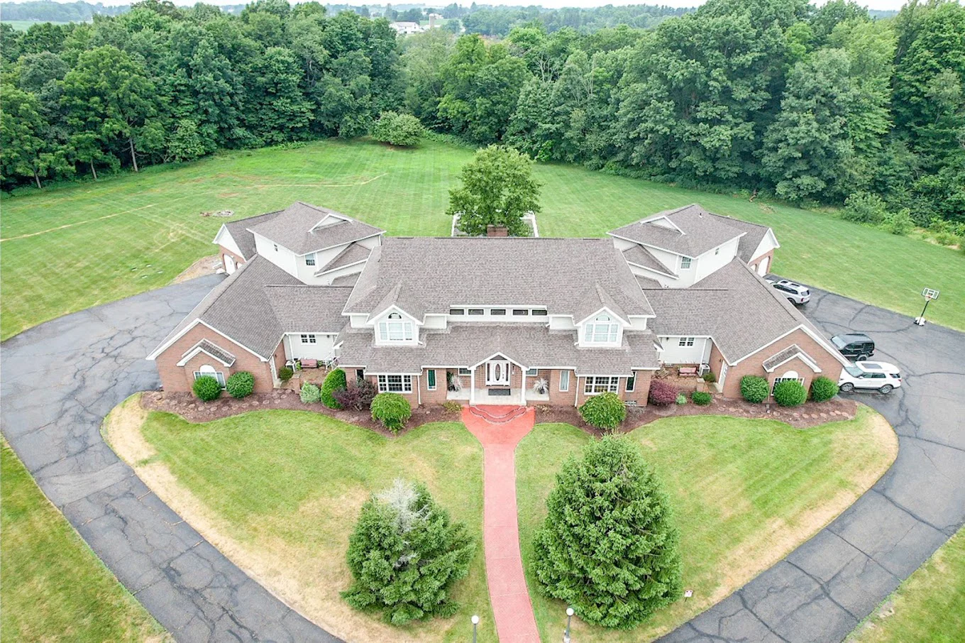 Aerial view of a large rehab facility with a circular driveway.