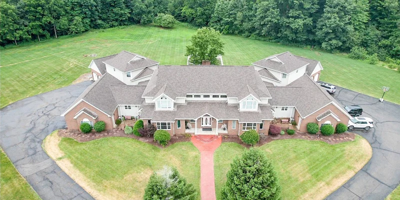 Aerial view of a large rehab facility with a circular driveway.