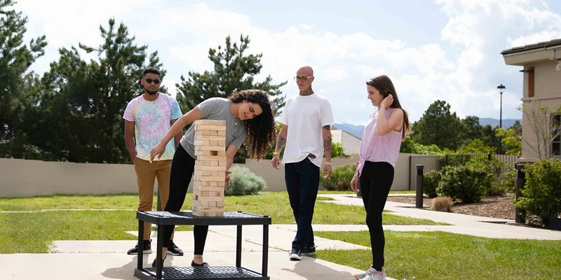 Outdoor group game of giant Jenga.