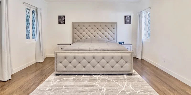 Private bedroom with bed and side-tables.