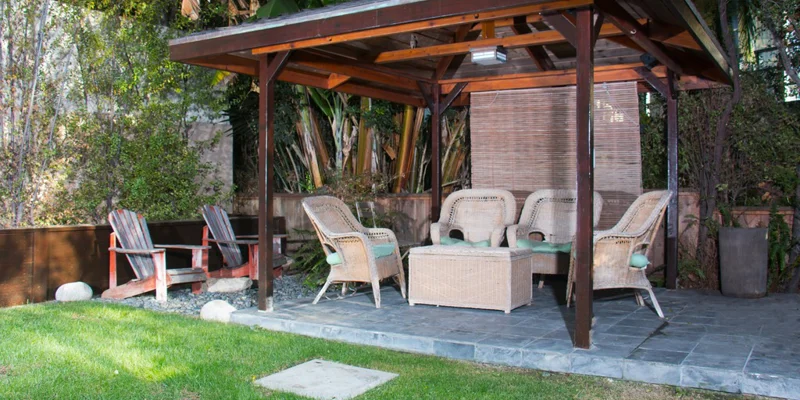 Shaded gazebo with seating.