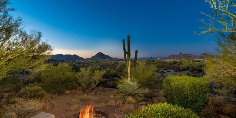 Firepit overlooking the desert at dusk.