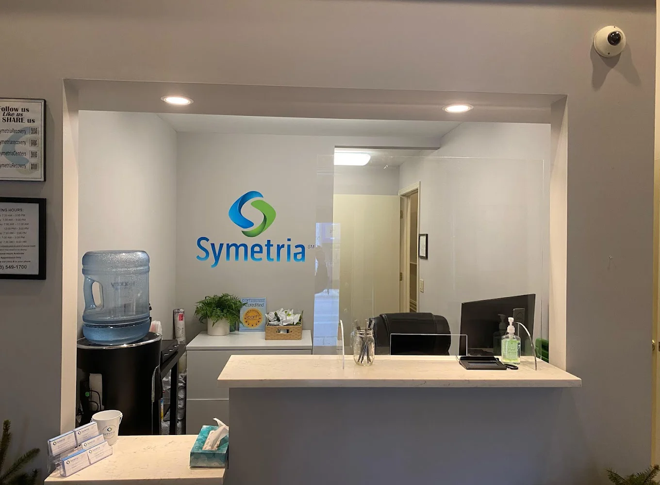 Reception area with Symetria Recovery logo.